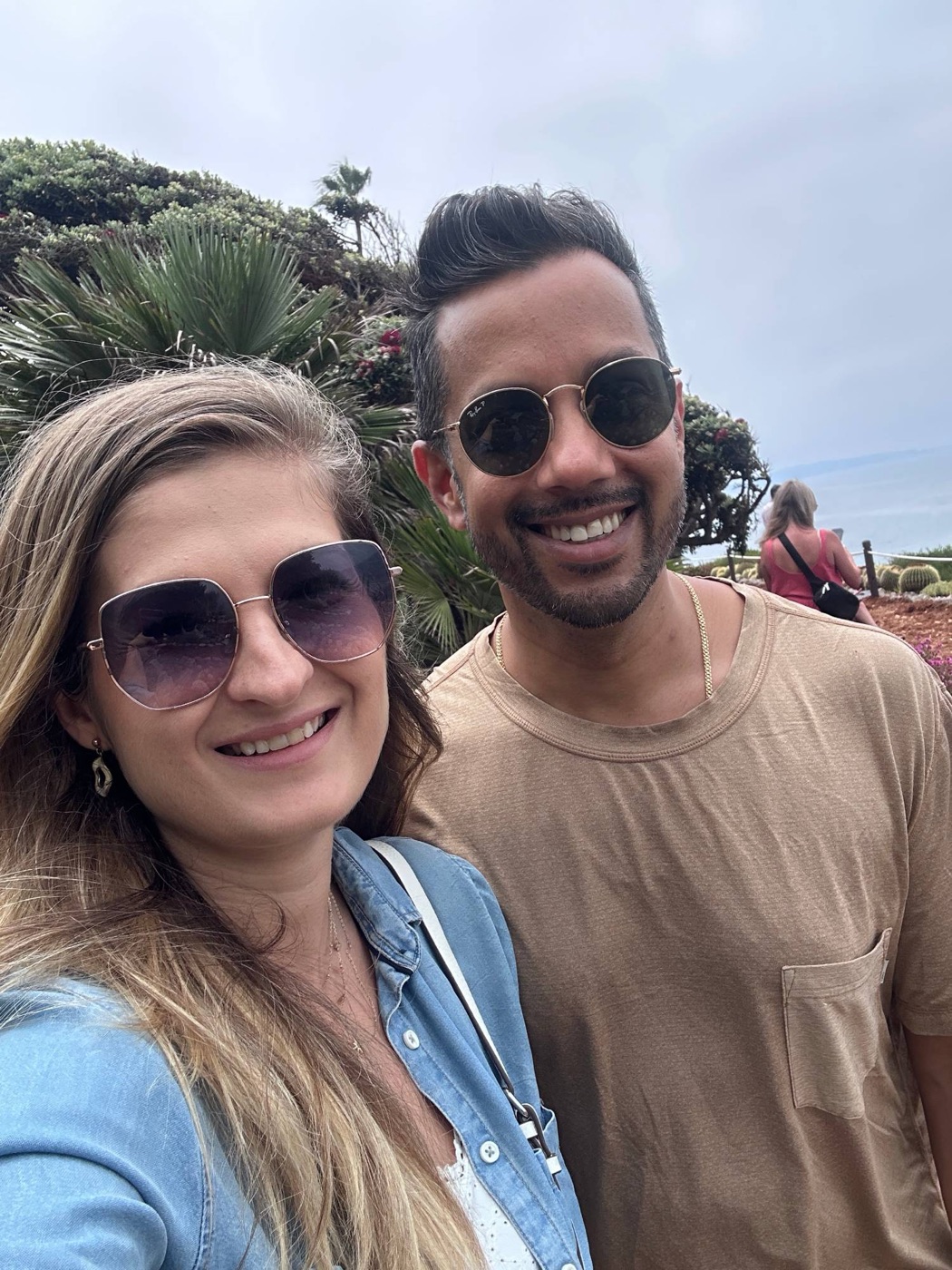 Simina and a colleague smiling on the coast