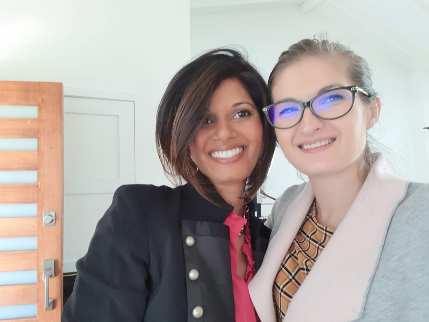 Simina and a client smiling on a shoot day