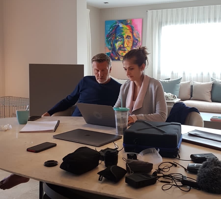 Simina working through a launch with a client at a laptop